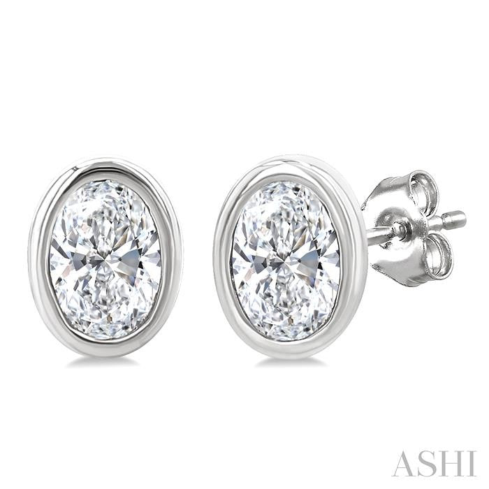 1/5 Ctw Petite Bezel Set Oval Cut Diamond Fashion Stud Earrings in 10K White Gold