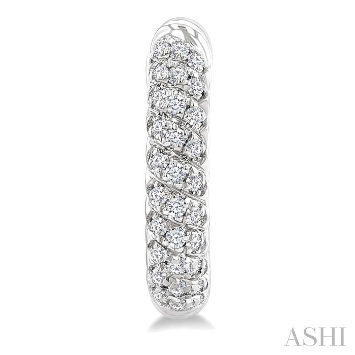 1/5 Ctw Petite Swirl Pattern Round Cut Diamond Fashion Huggies in 10K White Gold