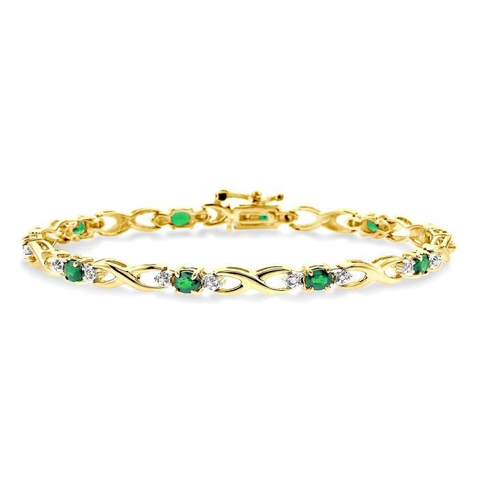 4x3 MM Oval Cut Emerald and 1/10 Ctw Round Cut Diamond Bracelet in 10K Yellow Gold