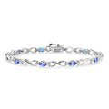 4x3mm Oval Cut Tanzanite and 1/10 Ctw Round Cut Diamond Bracelet in 10K White Gold