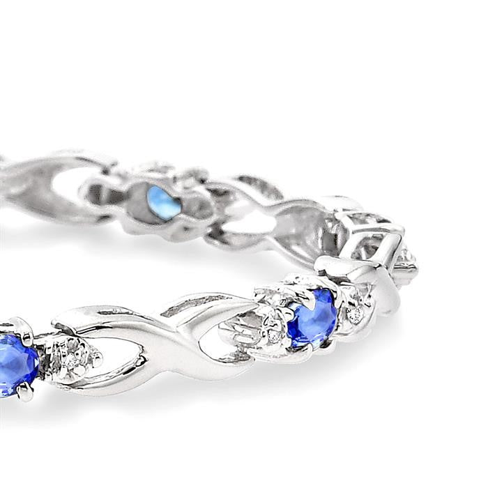 4x3mm Oval Cut Tanzanite and 1/10 Ctw Round Cut Diamond Bracelet in 10K White Gold