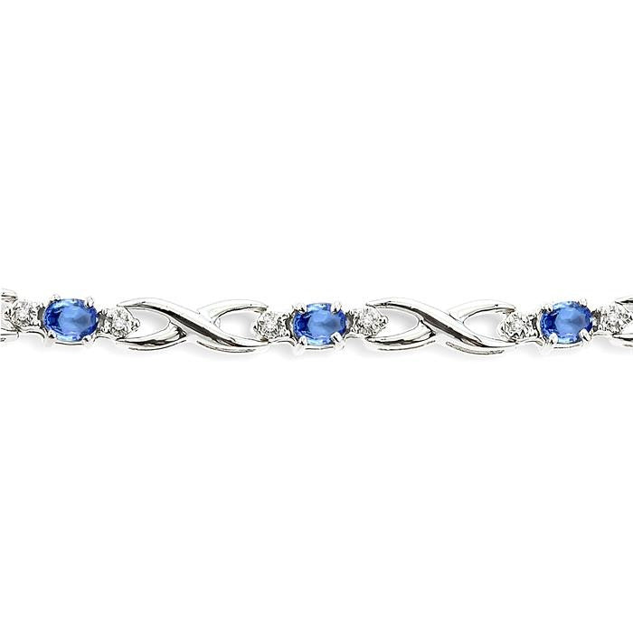 4x3mm Oval Cut Tanzanite and 1/10 Ctw Round Cut Diamond Bracelet in 10K White Gold