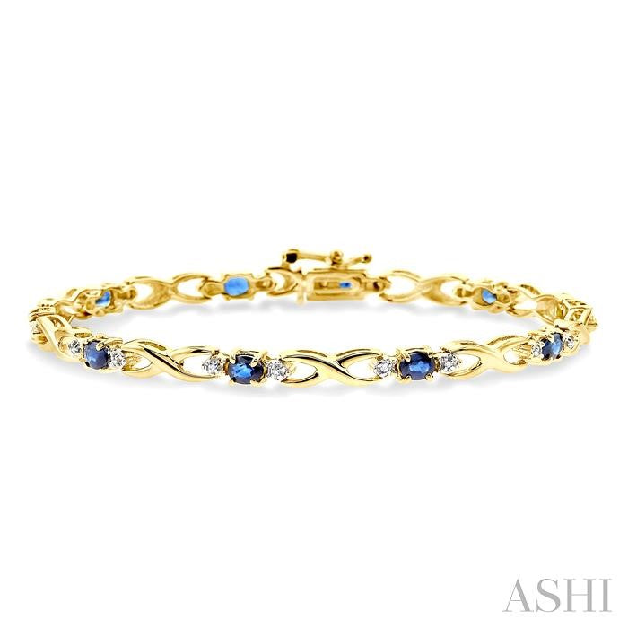 4x3 MM Oval Cut Sapphire and 1/10 Ctw Round Cut Diamond Bracelet in 10K Yellow Gold