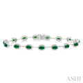 5x3 MM Oval Cut Emerald and 5/8 Ctw Round Cut Diamond Precious Bracelet in 14K White Gold
