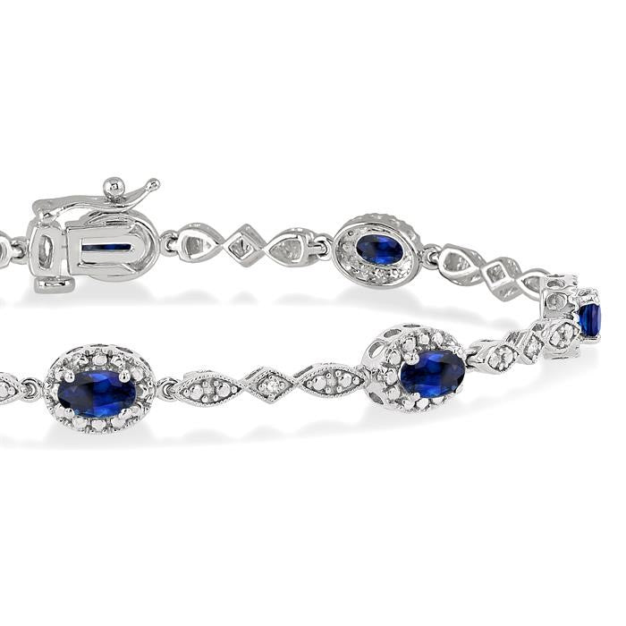 5x3 MM Oval Cut Sapphire and 1/20 Ctw Round Cut Diamond Bracelet in 14K White Gold