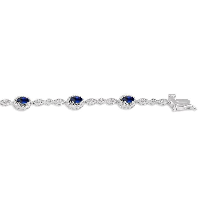 5x3 MM Oval Cut Sapphire and 1/20 Ctw Round Cut Diamond Bracelet in 14K White Gold
