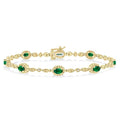 5x3 MM Oval Cut Emerald and 1/20 Ctw Round Cut Diamond Bracelet in 10K Yellow Gold
