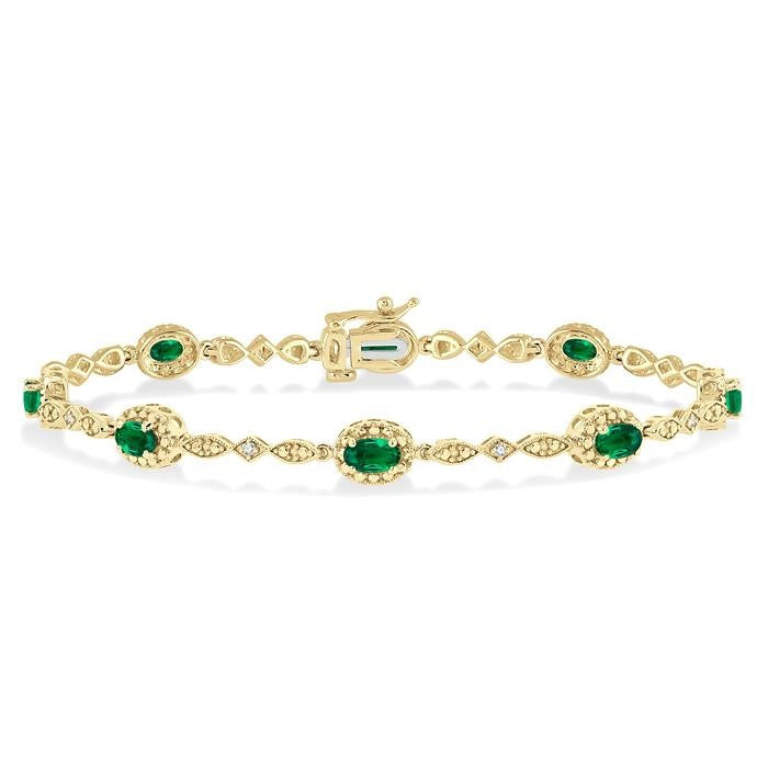 5x3 MM Oval Cut Emerald and 1/20 Ctw Round Cut Diamond Bracelet in 10K Yellow Gold
