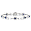 5x3 MM Oval Cut Sapphire and 1/20 Ctw Round Cut Diamond Bracelet in 10K White Gold