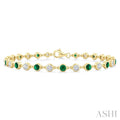 2.7 MM Round shape Emerald and 1 Ctw Round Cut Diamond Precious Station Bracelet in 14K Yellow Gold