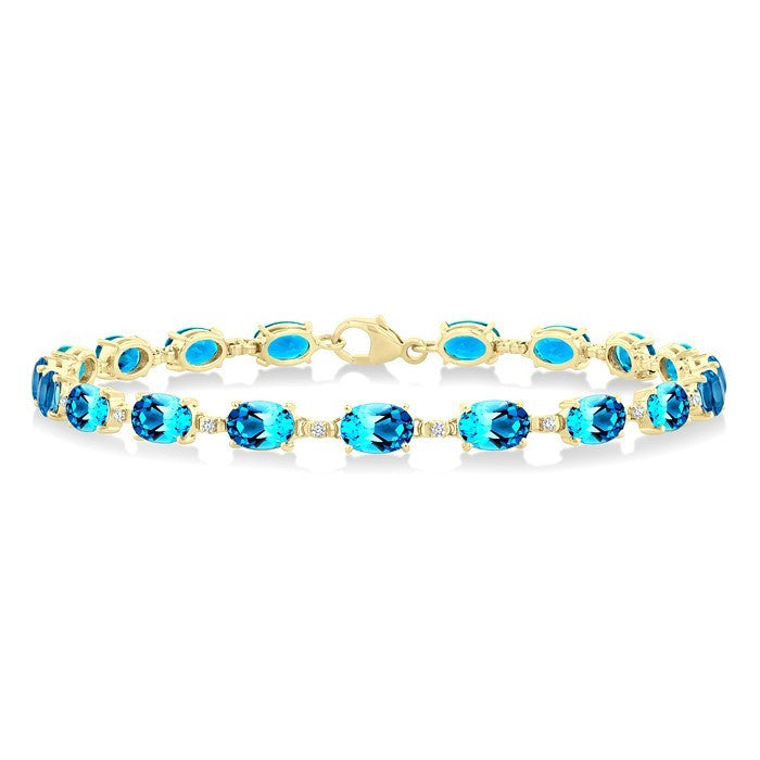 6X4 MM Oval Cut Blue Topaz and 1/6 Ctw Round Cut Diamond Semi-Precious Tennis Bracelet in 10K Yellow Gold