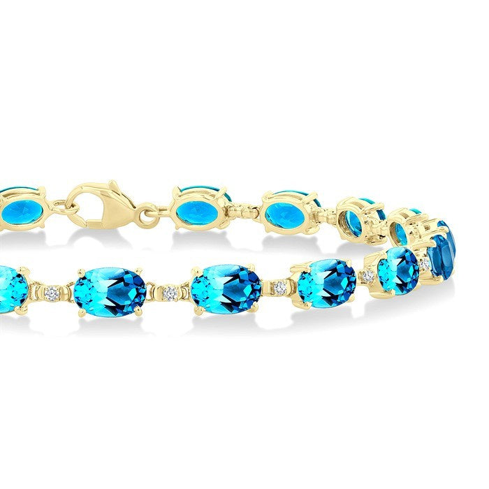 6X4 MM Oval Cut Blue Topaz and 1/6 Ctw Round Cut Diamond Semi-Precious Tennis Bracelet in 10K Yellow Gold