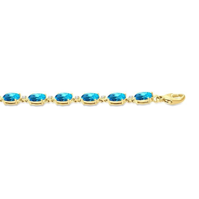 6X4 MM Oval Cut Blue Topaz and 1/6 Ctw Round Cut Diamond Semi-Precious Tennis Bracelet in 10K Yellow Gold