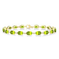 6X4 MM Oval Cut Peridot and 1/6 Ctw Round Cut Diamond Semi-Precious Tennis Bracelet in 10K Yellow Gold