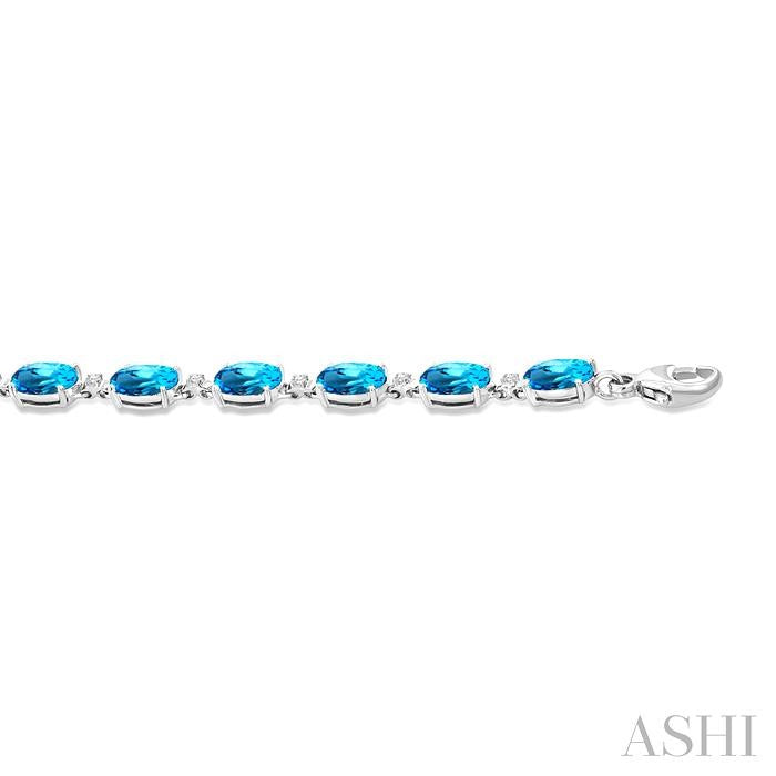 6X4 MM Oval Cut Blue Topaz and 1/6 Ctw Round Cut Diamond Semi-Precious Tennis Bracelet in 10K White Gold