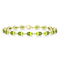 6X4 MM Oval Cut Peridot and 1/6 Ctw Round Cut Diamond Semi-Precious Tennis Bracelet in 10K Yellow Gold