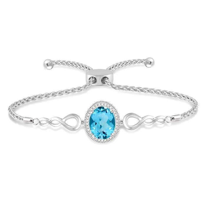 10x8 MM Oval Shape Blue Topaz and 1/20 Ctw Round shape Diamond Sterling Silver Lariat Bracelet