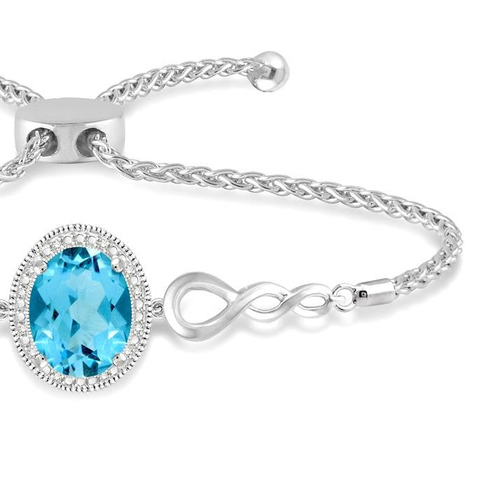 10x8 MM Oval Shape Blue Topaz and 1/20 Ctw Round shape Diamond Sterling Silver Lariat Bracelet