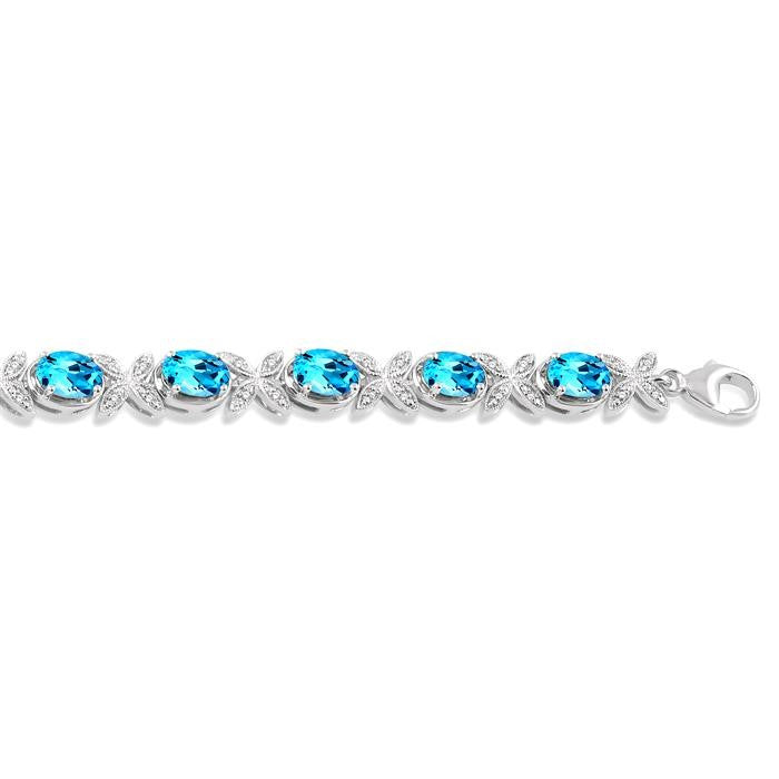 7x5 MM Oval Cut Blue Topaz and 1/10 Ctw Round Cut Diamond Semi-Precious Bracelet in Sterling Silver