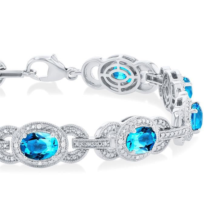 7x5 MM Oval Shape Blue Topaz and 1/10 Ctw Round Cut Diamond Semi-Precious Bracelet in Sterling Silver