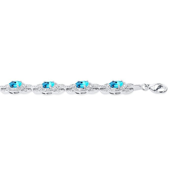 7x5 MM Oval Shape Blue Topaz and 1/10 Ctw Round Cut Diamond Semi-Precious Bracelet in Sterling Silver