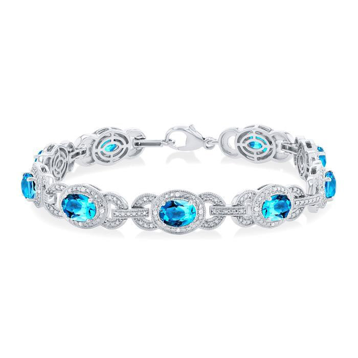 Oval Shape Blue Topaz and 1/10 Ctw Round Cut Diamond Semi-Precious Bracelet