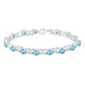 Silver Oval Shape Blue Topaz Gemstone & 1/20CTW Diamond Bracelet