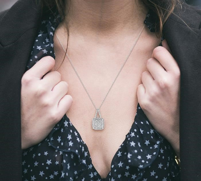 1/20 Ctw Round Cut Diamond Pendant in Sterling Silver with Chain