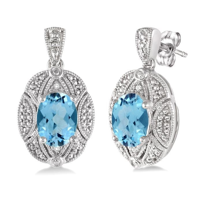 8x6 MM Oval Cut Blue Topaz and 1/50 Ctw Round Cut Diamond Earrings in Sterling Silver