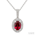7X5 MM Oval Shape Lab-Created Ruby and 1/50 Ctw Round Cut Diamond Precious Pendant With Chain in Sterling Silver