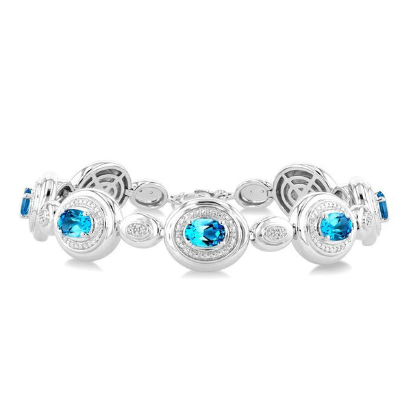 7X5 MM Oval Shape Blue Topaz and 1/10 Ctw Round Cut Diamond Bold Bracelet in Sterling Silver