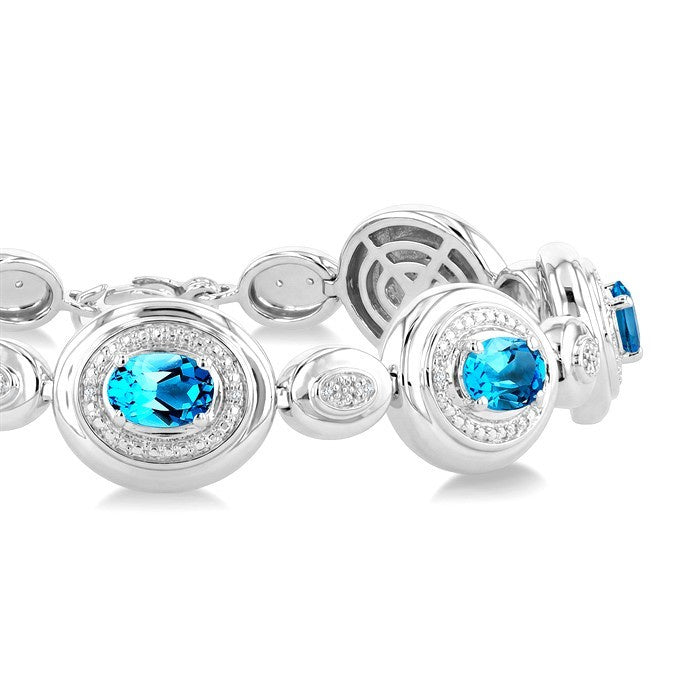 7X5 MM Oval Shape Blue Topaz and 1/10 Ctw Round Cut Diamond Bold Bracelet in Sterling Silver