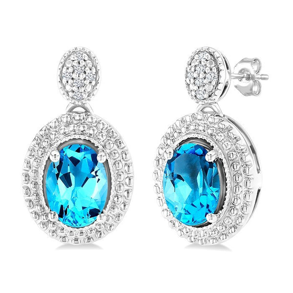 7X5 MM Oval Cut Blue Topaz and 1/20 Ctw Round Cut Diamond Semi-Precious Earrings in Sterling Silver