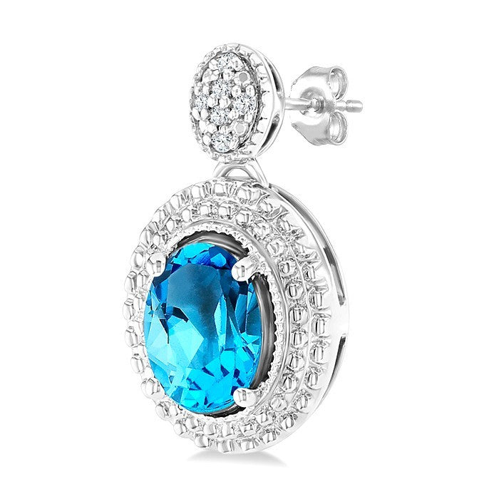 7X5 MM Oval Cut Blue Topaz and 1/20 Ctw Round Cut Diamond Semi-Precious Earrings in Sterling Silver