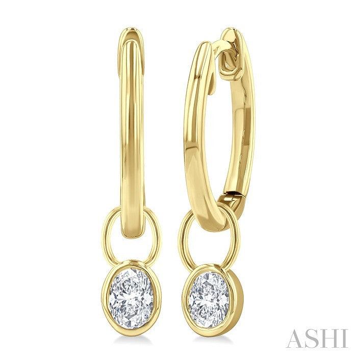 1/3 Ctw Bezel Set Oval Cut Diamond Huggie Earrings in 14K Yellow Gold