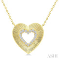 1/8 Ctw Round Cut Diamond Pirouette Heart Fashion Pendant With Chain in 10K Yellow Gold