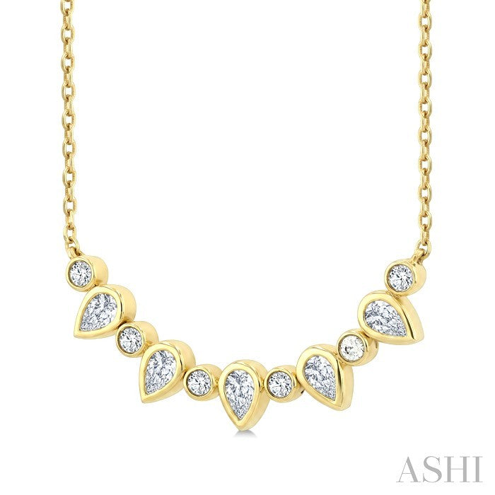 5/8 Ctw Bezel Set Pear and Round Cut Diamond Necklace in 14K Yellow Gold