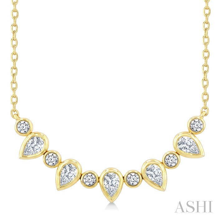 5/8 Ctw Bezel Set Pear and Round Cut Diamond Necklace in 14K Yellow Gold