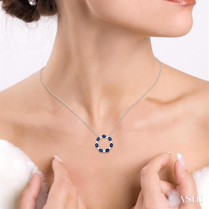 4x3 MM Oval Cut Sapphire and 1/4 Ctw Round Cut Diamond Circle Pendant With Chain in 14K White Gold