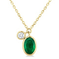 6x4 MM Oval Cut Emerald and 1/20 Ctw Bezel Set Round Cut Diamond Precious Pendant With Chain in 14K Yellow Gold
