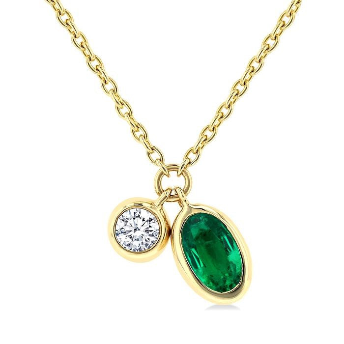 5x3 MM Oval Cut Emerald and 1/50 Ctw Bezel Set Round Cut Diamond Precious Pendant With Chain in 10K Yellow Gold