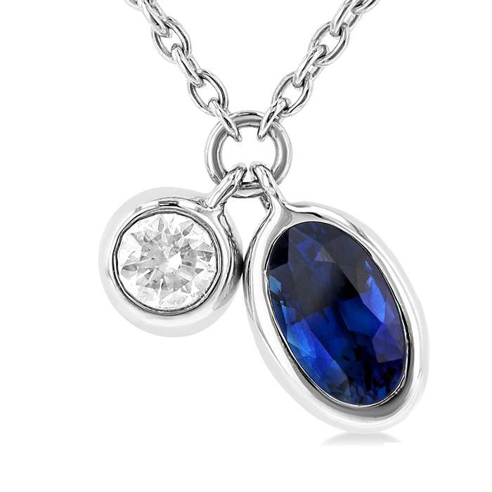 5x3 MM Oval Cut Sapphire and 1/50 Ctw Bezel Set Round Cut Diamond Precious Pendant With Chain in 10K White Gold