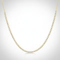 Gold necklace with diamonds on a white background