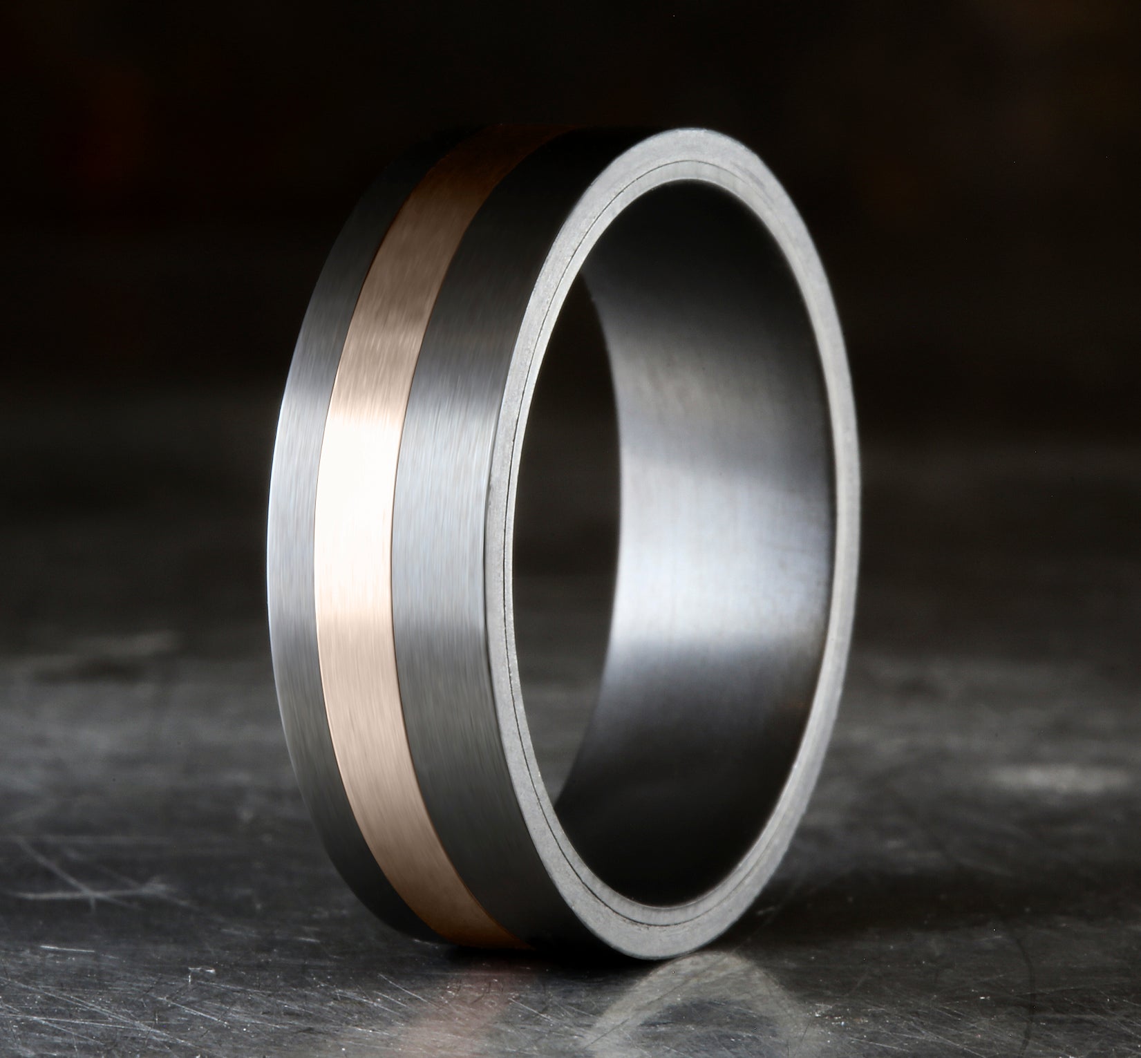 THE HERO 7mm, Darkened Tantalum and 14K Rose Gold, Satin finish with an offset stripe