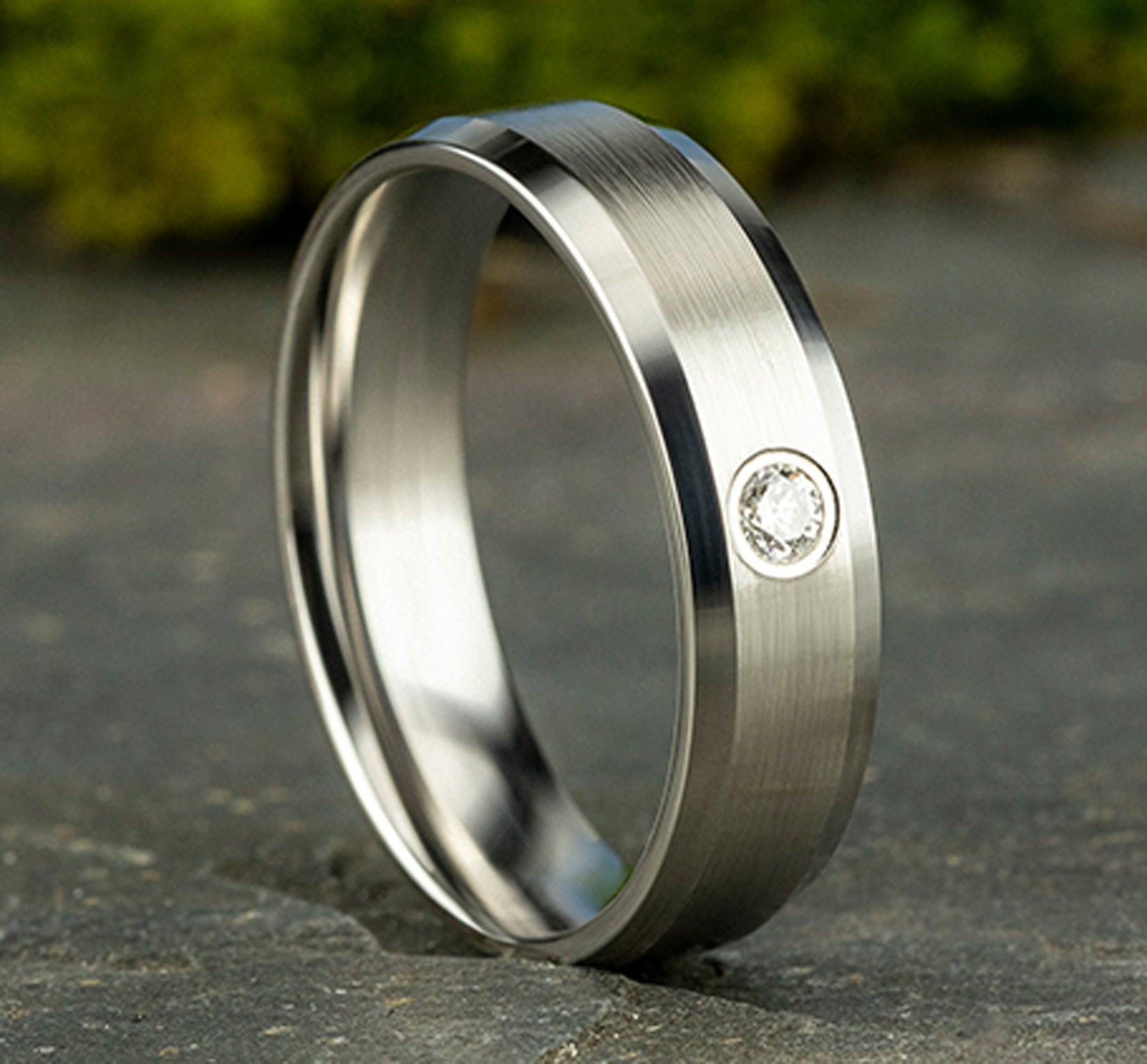 THE ALEXANDER 6mm, Comfort fit, 14K White Gold, Satin finish, polished bevel edges, 1 burnish set diamond, Carat weight is .08ct, Clarity SI1-2, Color GH