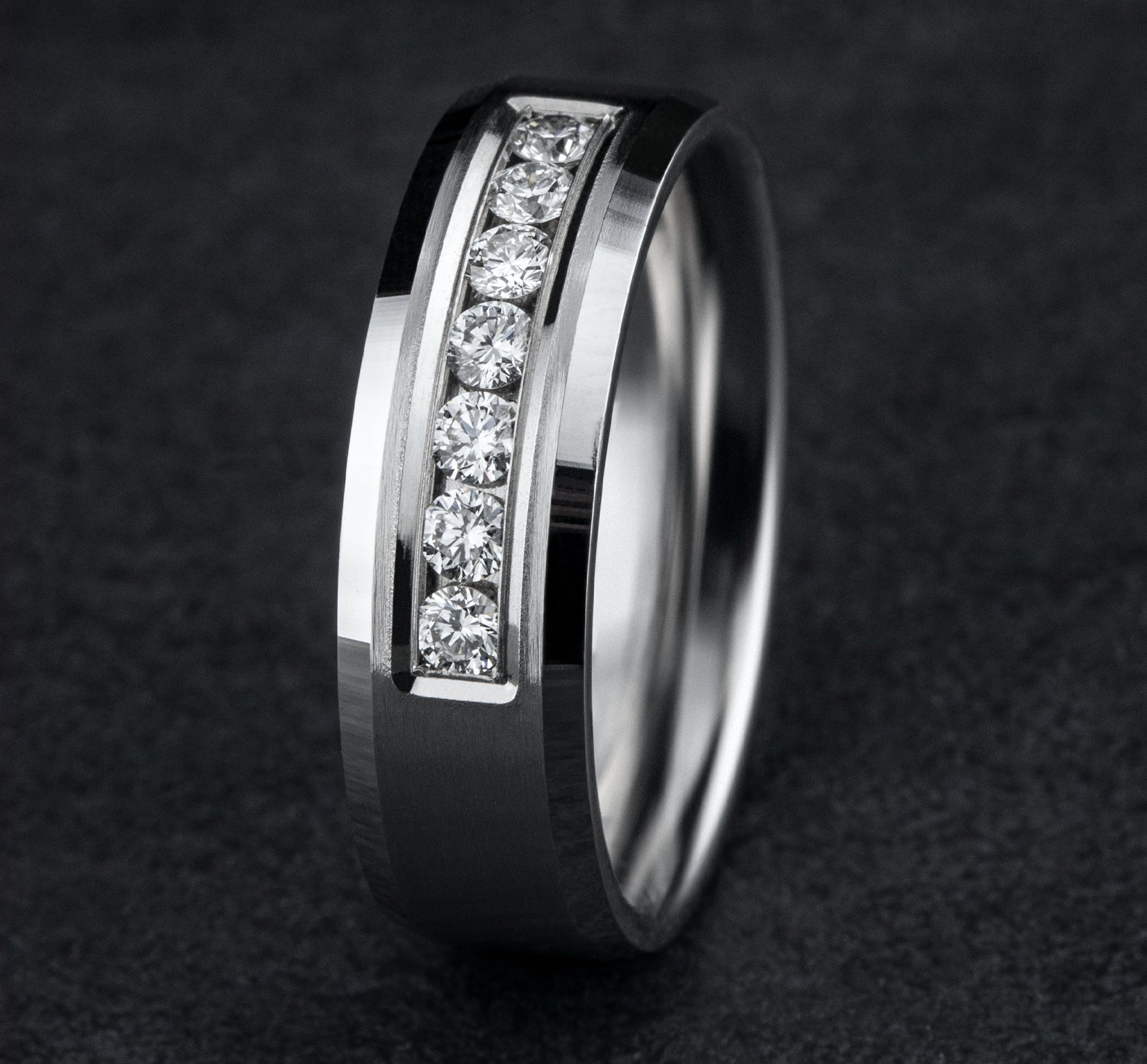 THE GENTLEMAN 7mm, Comfort fit, 14K White Gold, Satin center, bevel edges, 7 channel set diamonds, Carat weight is .42ct, Clarity SI1-2, Color GH