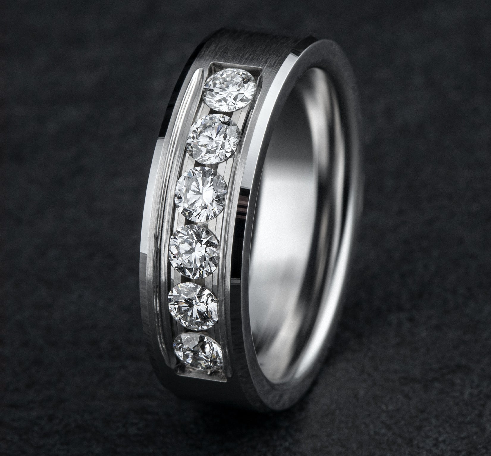 THE MONARCH 7mm, Comfort fit, 14K White Gold, Satin center, bevel edges, 6 channel set diamonds, Carat weight is .96ct, Clarity SI1-2, Color GH
