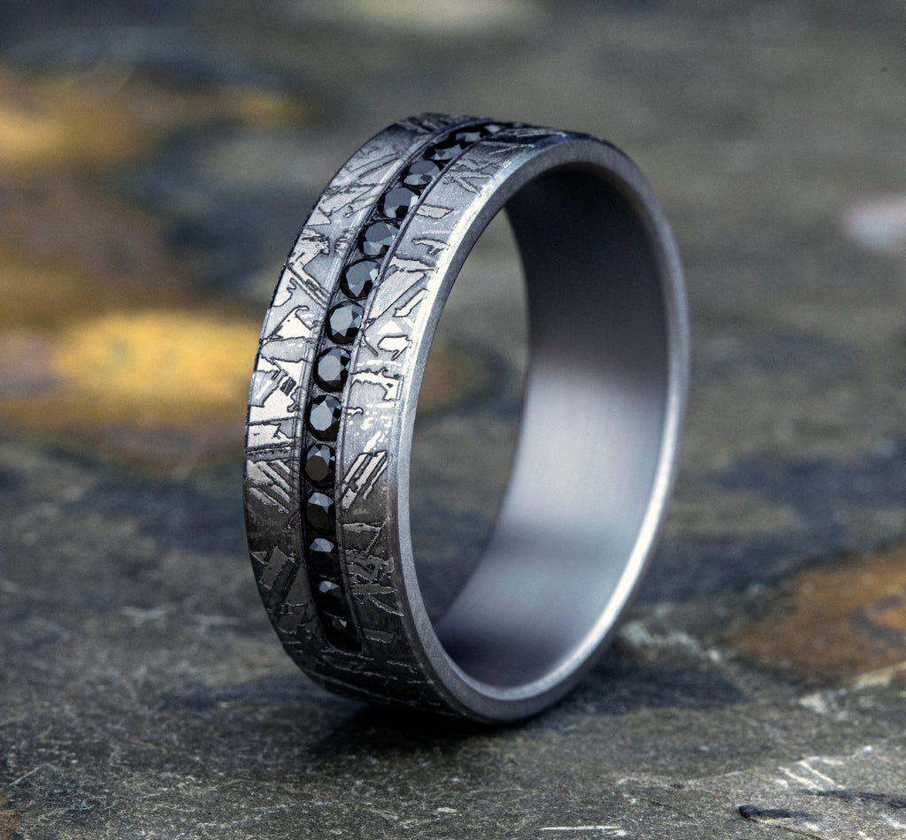 The Odessa 7mm, Comfort fit, Grey Tantalum, Meteorite pattern, 20 channel set black diamonds, Carat weight is .40ct