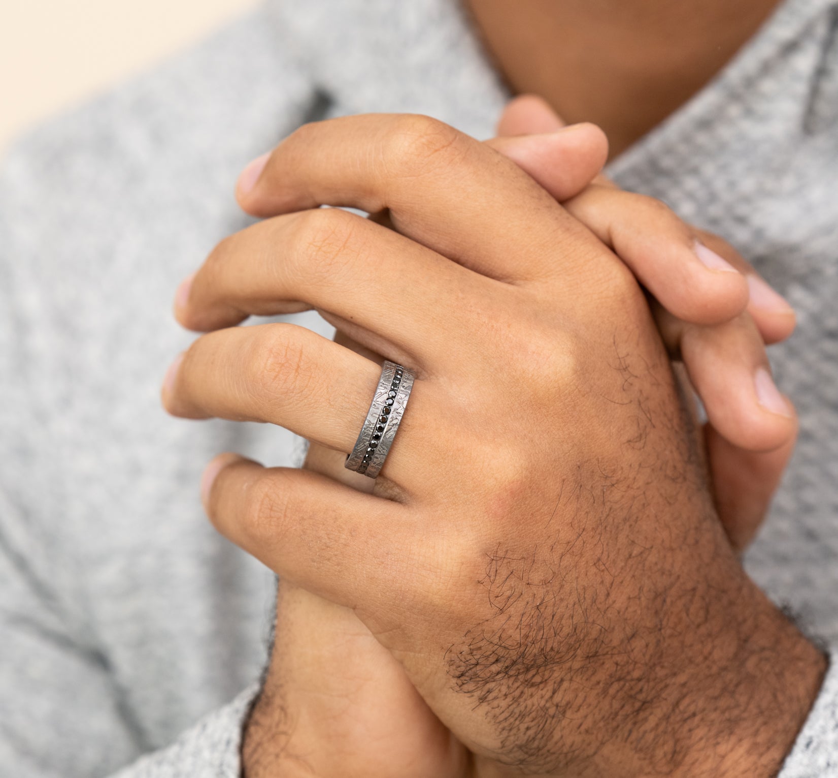 The Odessa 7mm, Comfort fit, Grey Tantalum, Meteorite pattern, 20 channel set black diamonds, Carat weight is .40ct