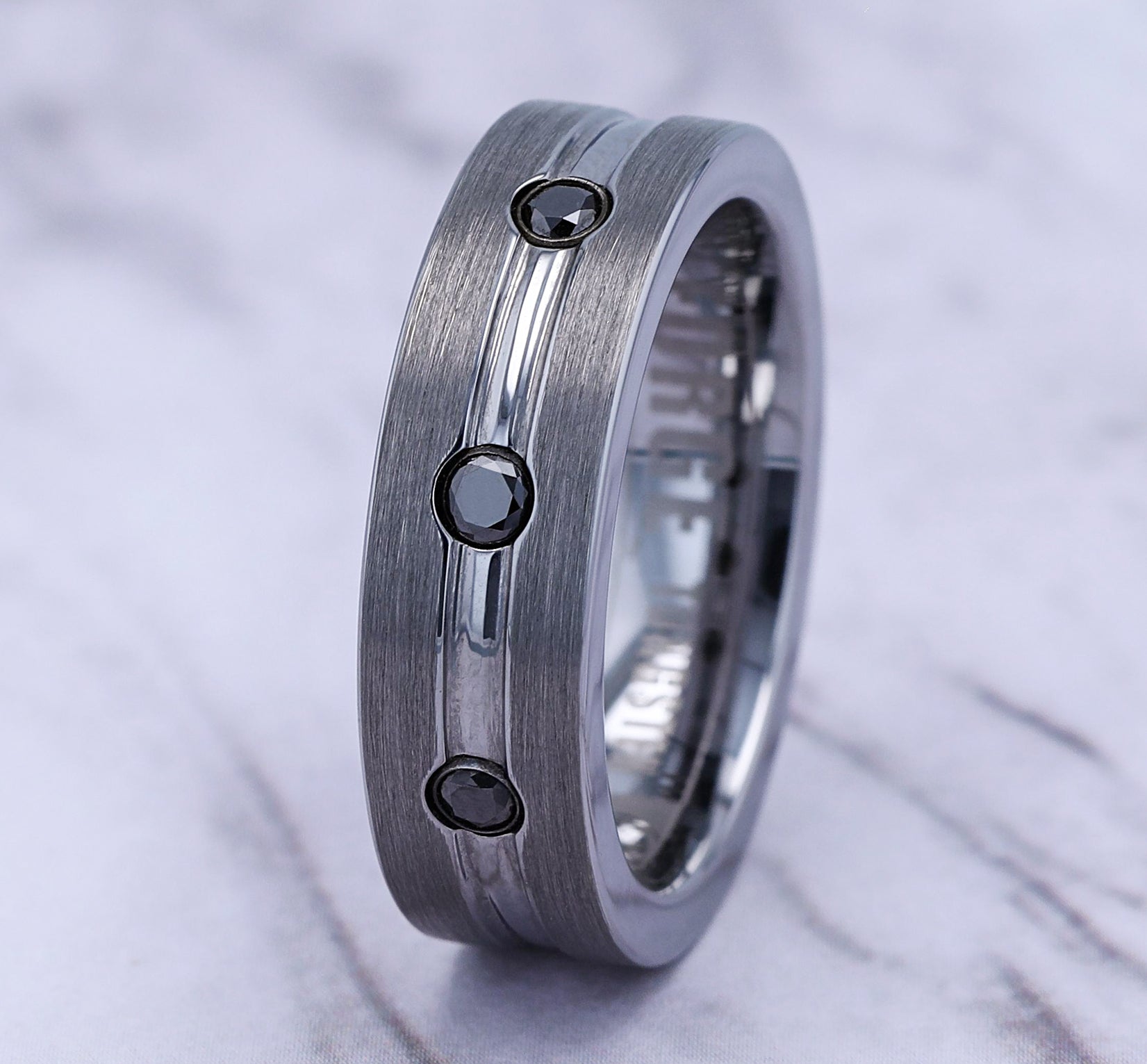 THE QUINCY 7mm, Comfort fit, Tungsten, Satin center, polished double center cuts with black diamonds, 3 burnish set black diamonds, Carat weight is .20ct